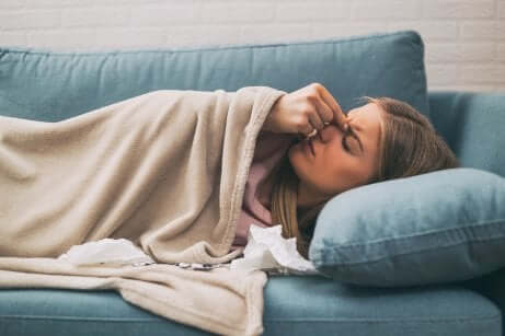 A sick woman on a couch.