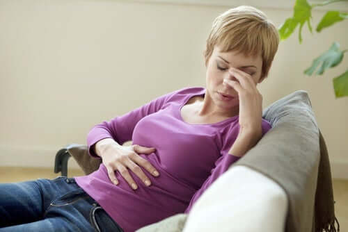 A woman with a stomach ache.