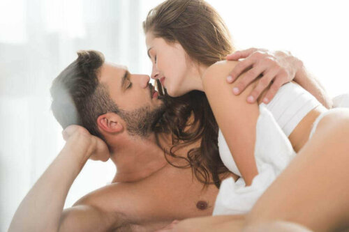 A couple kissing each other.