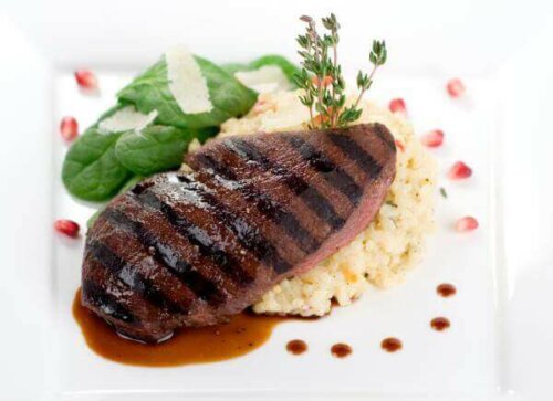A plate of liver and mashed potatoes.