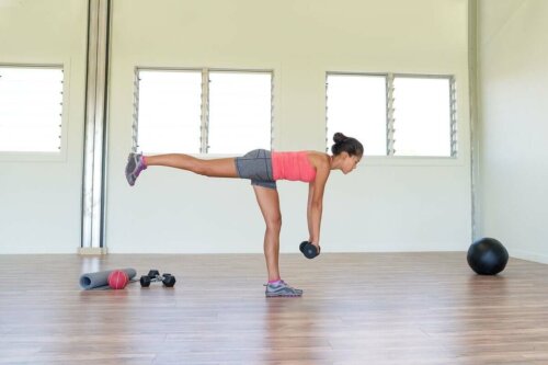 A woman doing leg exercises with weights.