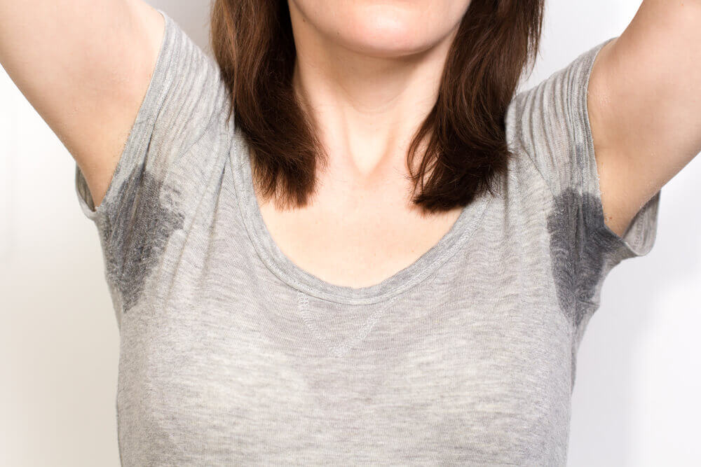 This woman may want to treat excessive sweating.