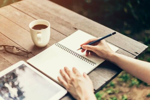 A person writing in a journal.