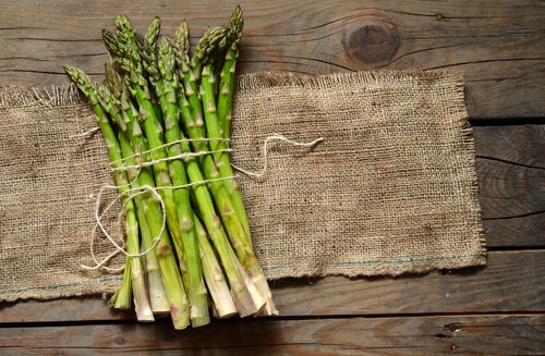 Some cut asparagus on a table.