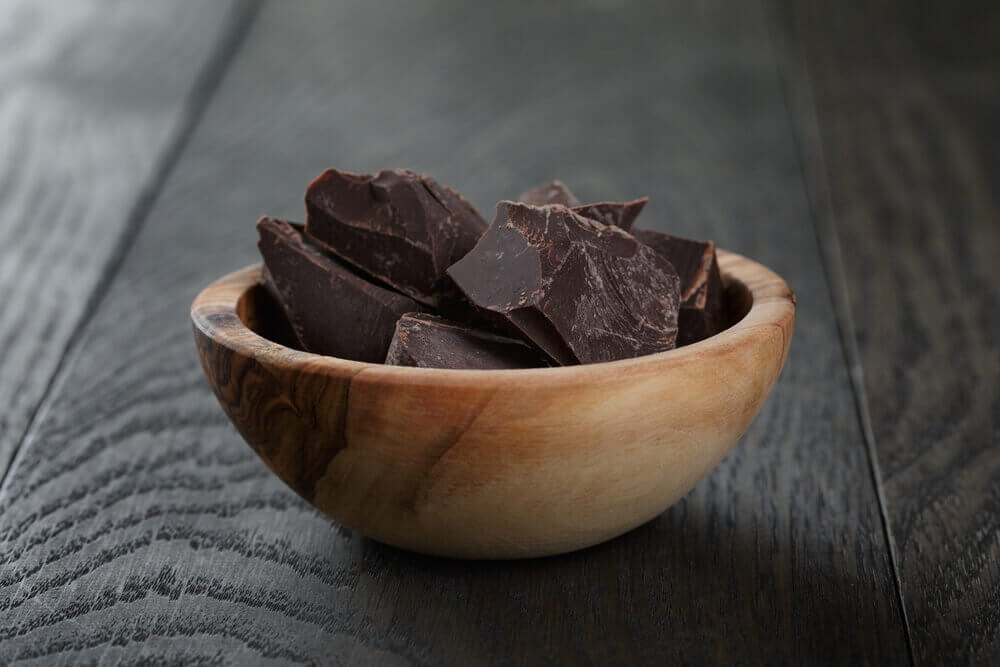 A bowl of pieces of chocolate.