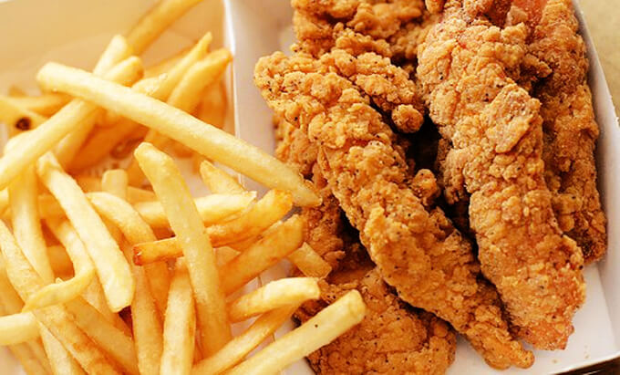Some french fries and chicken tenders.