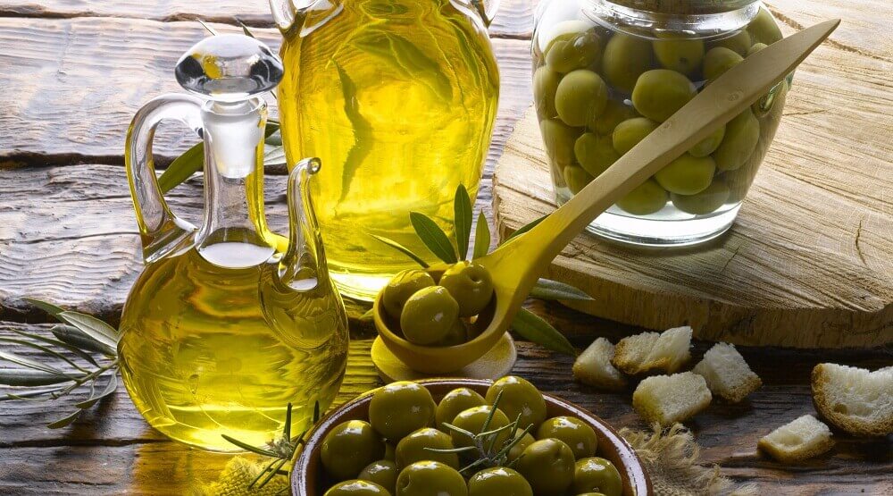 Some bottles of olives and olive oil for frying.