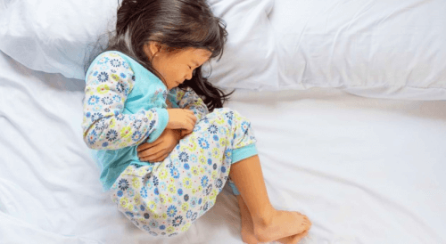 A girl with a sever tummy ache.