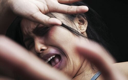 screaming woman in fear from domestic violence