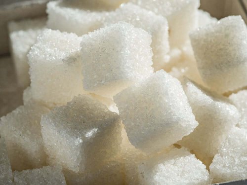 A close up photo of sugar cubes.