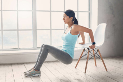 woman doing exercise with a chair; toned stomach in 3 weeks
