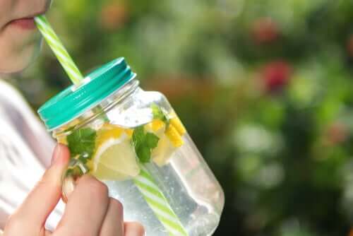 woman drinking water; aphonia and dysphonia cure