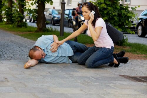 A woman calling an ambulance during a cardiac emergency.