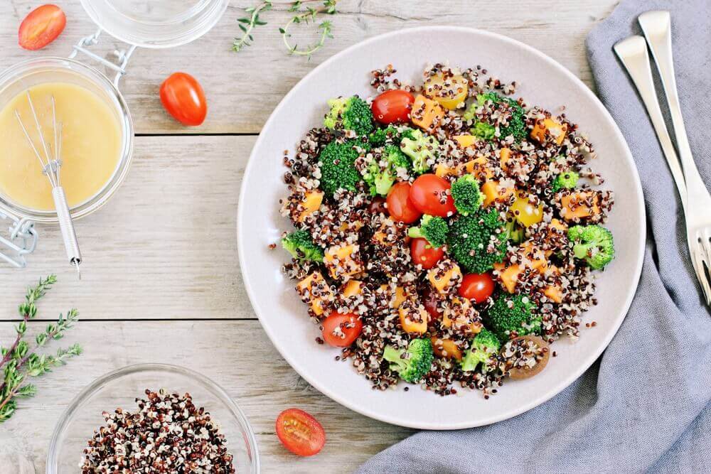 Quinoa in a salad with broccoli tomatoes and corn