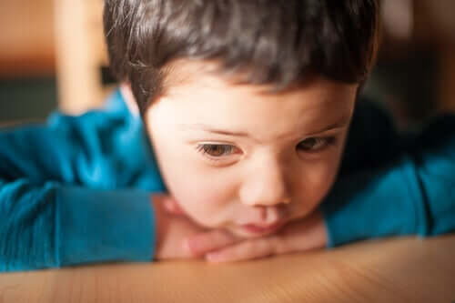 A toddler looking sad.