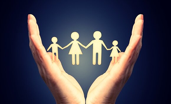 four member family inside two hands