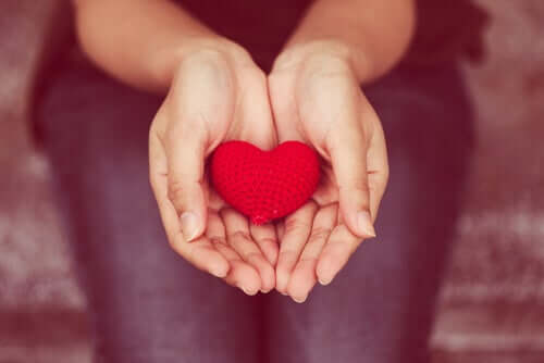 A woman's hands with a heart in them.