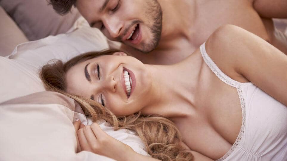 man whispering to his partner during sex