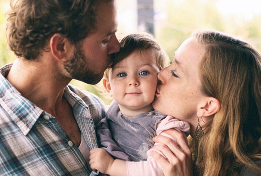 a young couple and a baby.