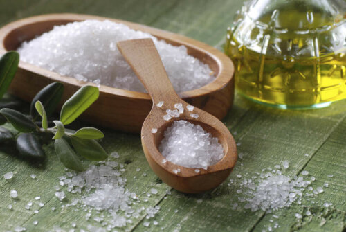 sea salt in a wooden pot with a wooden spoon