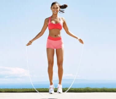 A woman skipping.