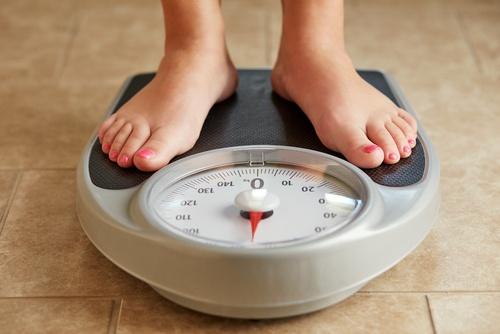 woman weighing herself