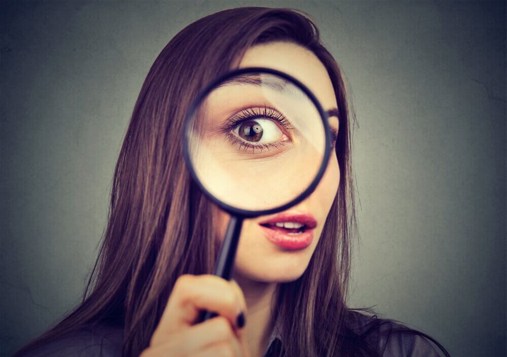 woman with a magnifying glass