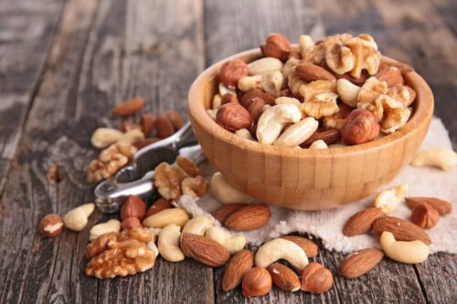 A bowl of nuts on a table.