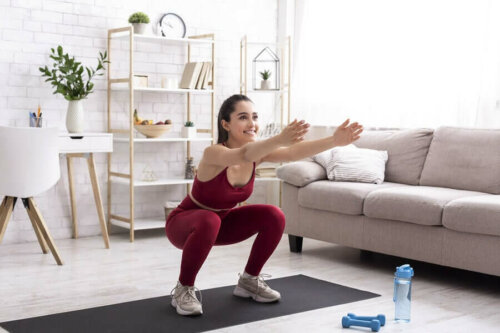 A woman doing exercise in her living room.