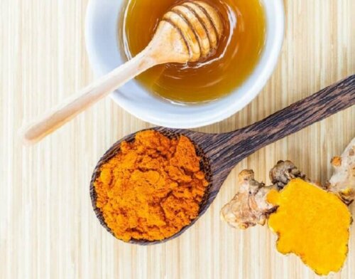 Some turmeric and honey ready to be mixed together.