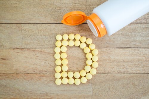 Vitamin D capsules forming the letter D.