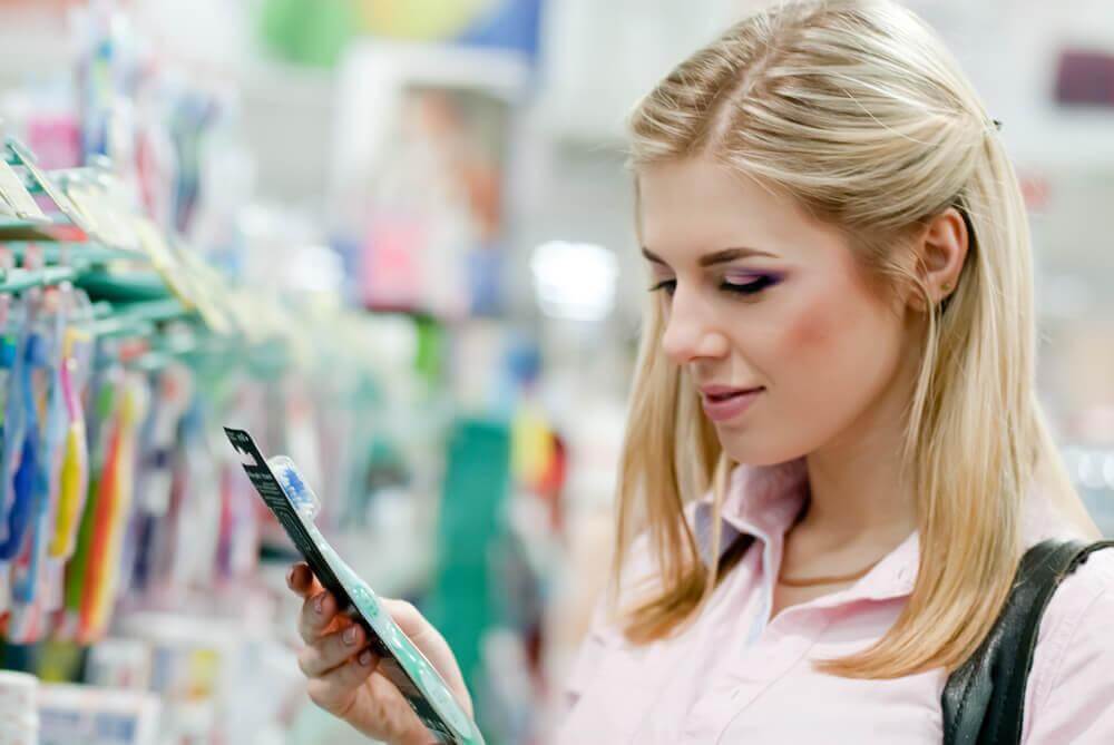 woman buying a new toothbrush
