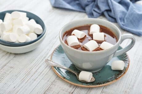 A cup of hot chocolate with marshmallows.