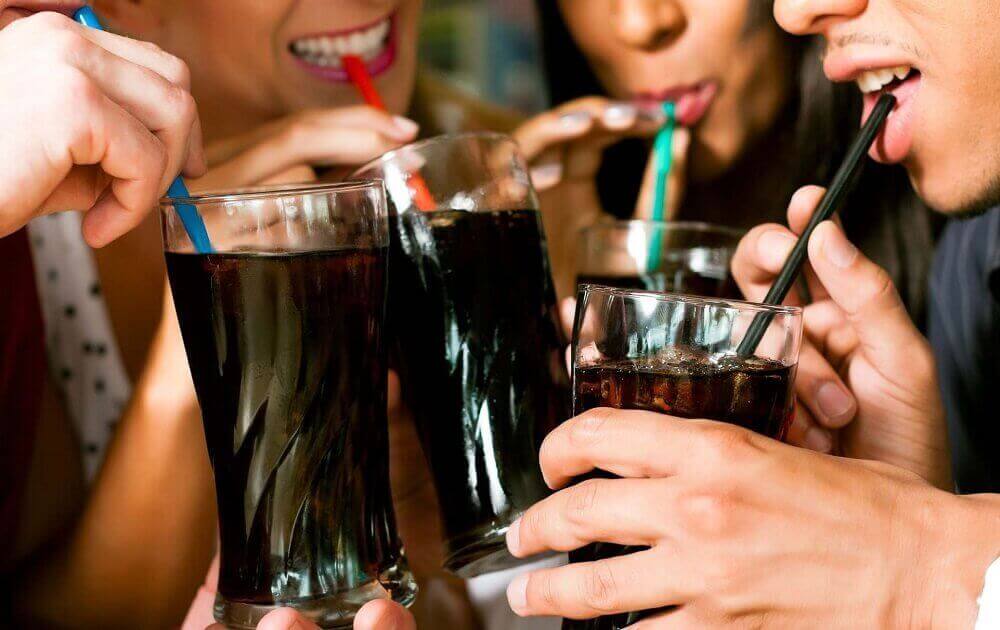 group of people drinking fizzy drinks