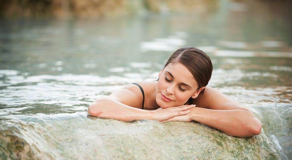 woman soaking in a hot spring