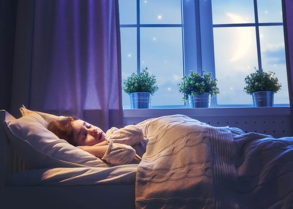A child having a good night's sleep because they don't have intestinal parasites.