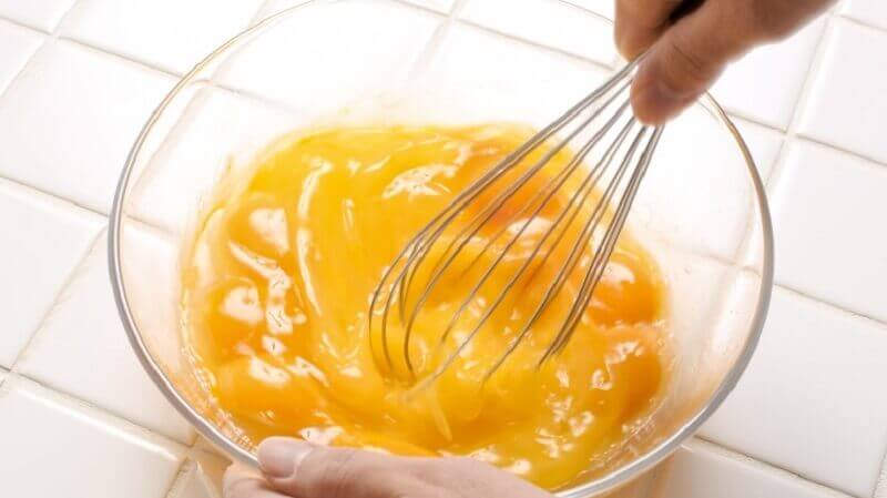 Beating eggs in a bowl