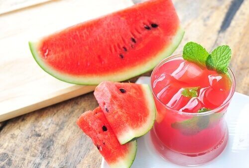 Slices of watermelon and a glass of watermelon juice