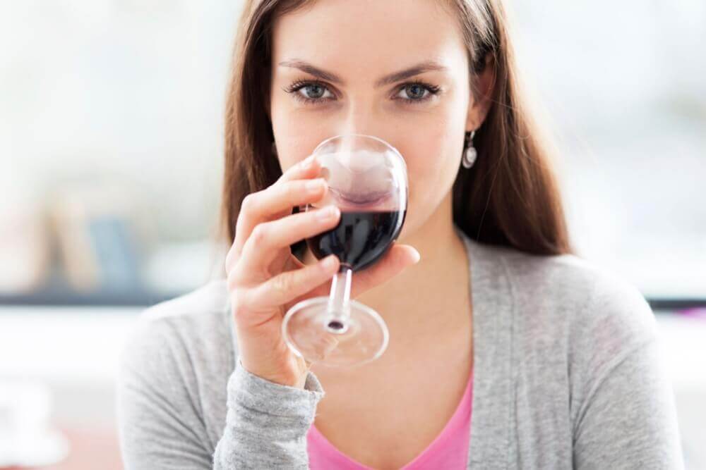 Woman drinking red wine