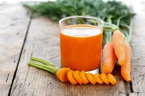 A glass of carrot juice.