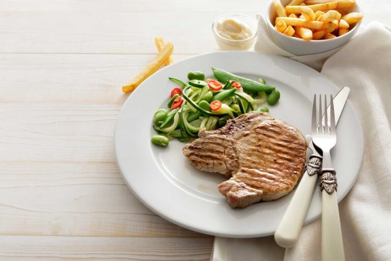 A healthy dinner with meat and veggies.