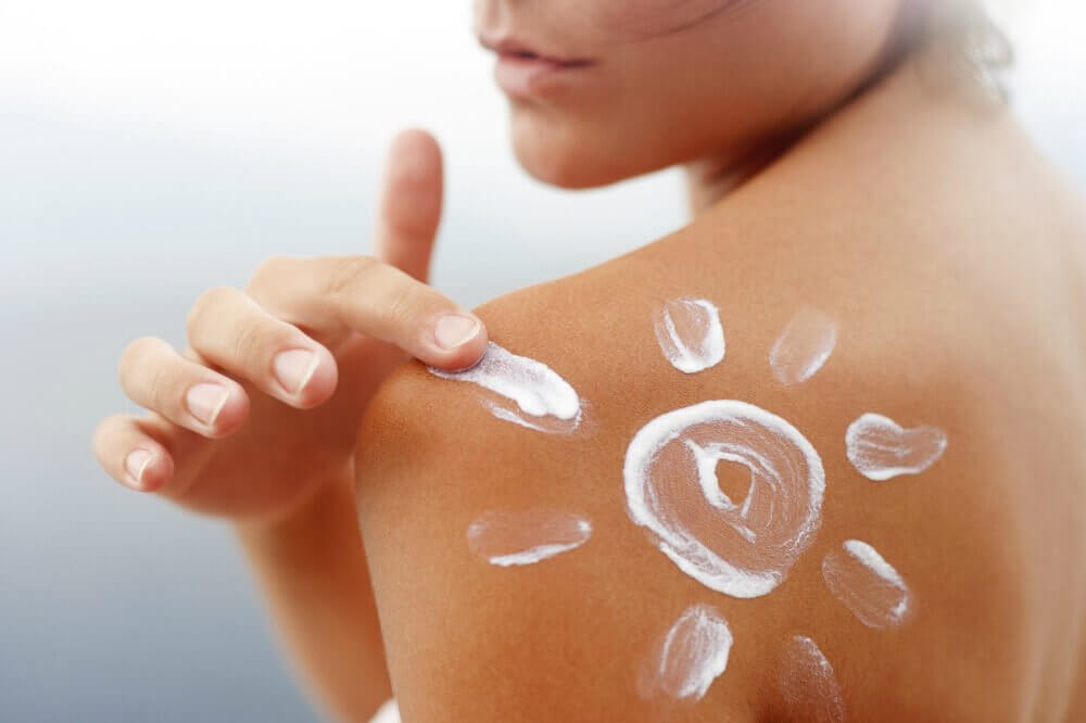 Woman using milk of magnesia to treat sunburn
