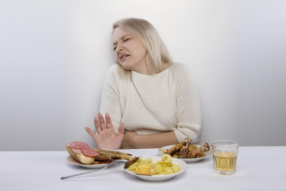 A woman with stomach pain.