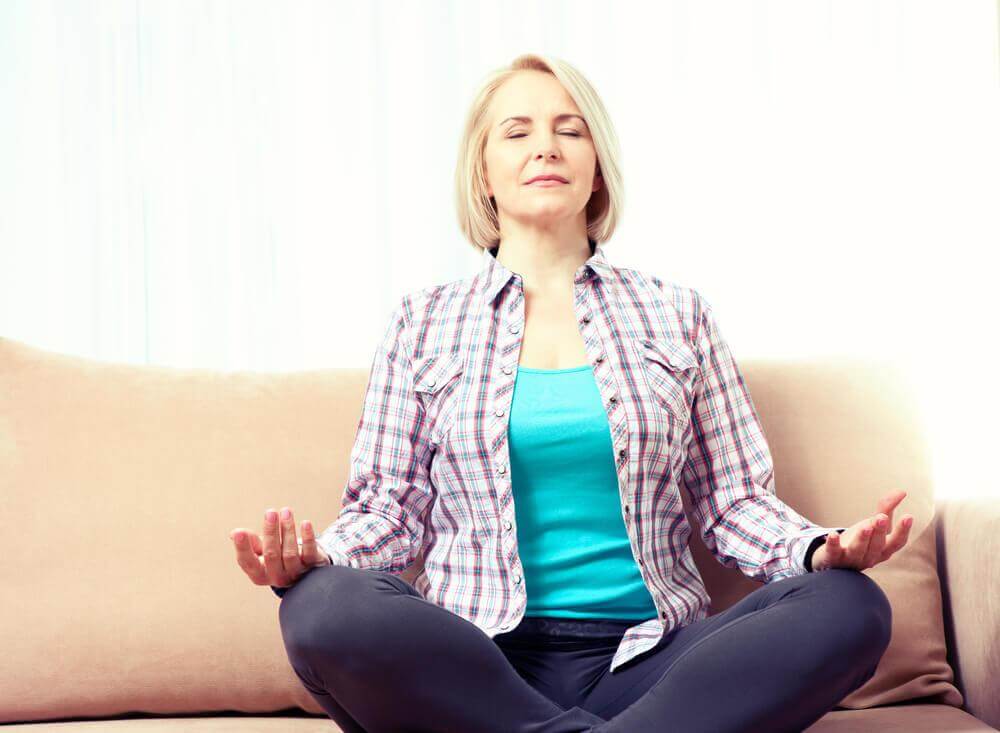 older woman meditating