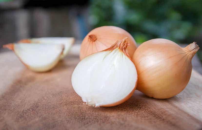 Onions on a cutting board.