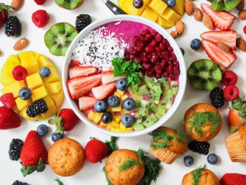 A salad with papaya and pineapple and other fruits.