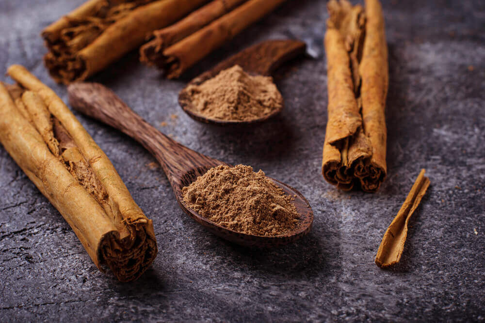 Some cinnamon sticks on a table.