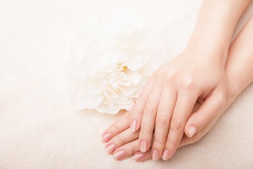 A woman using homemade hand creams