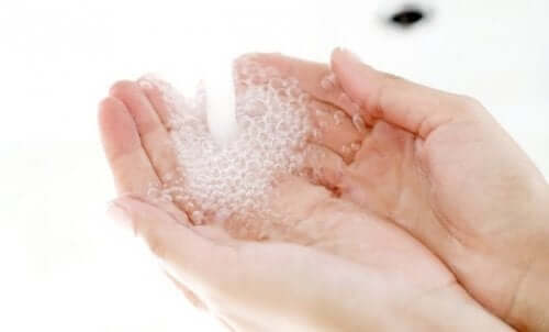 A person washing their hands.