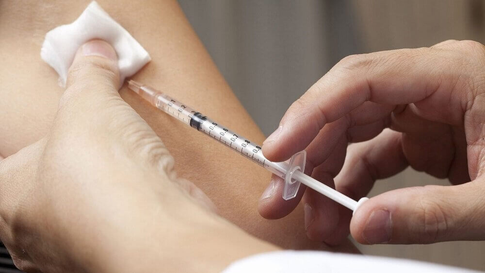Getting a shot for seasonal allergies.